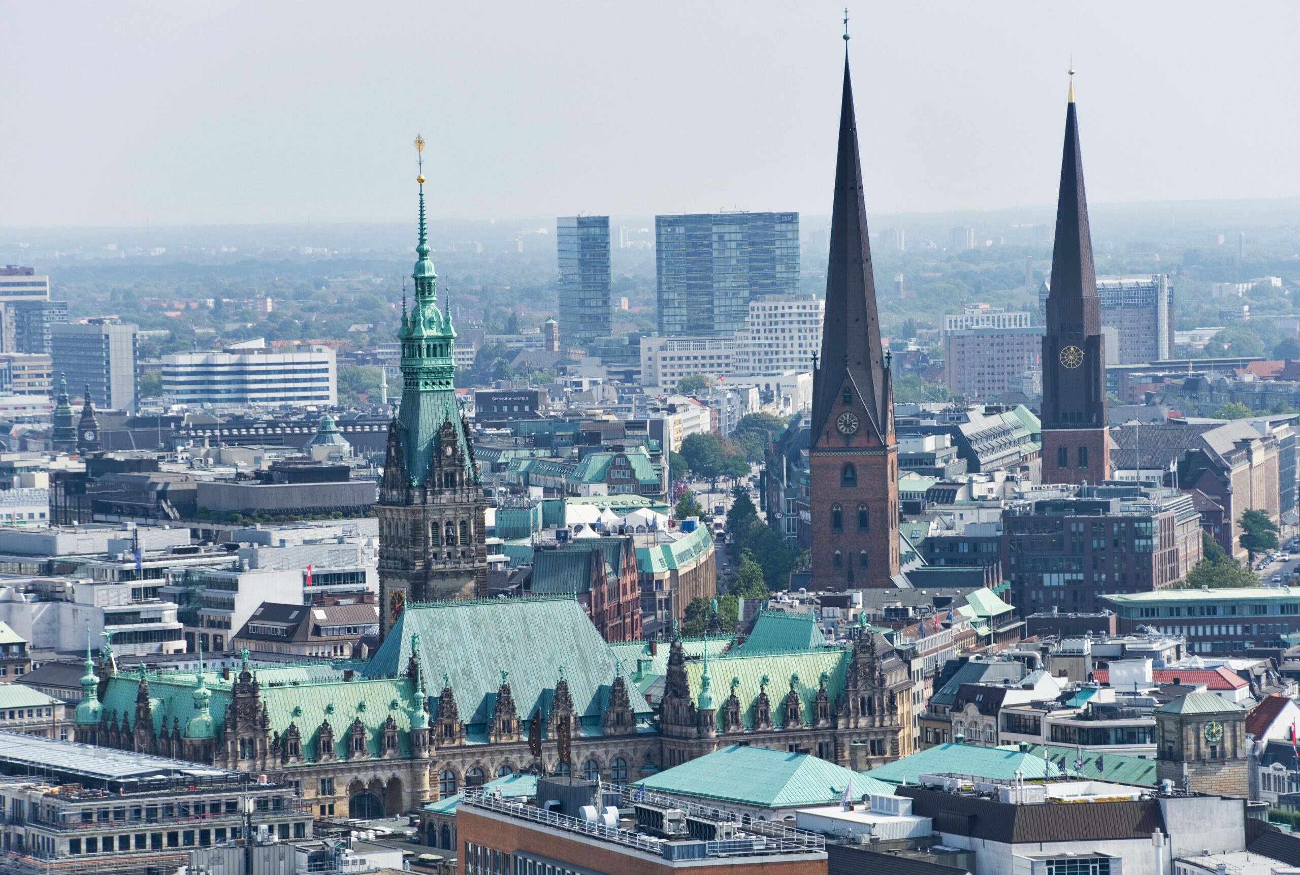 Hamburg city skyline featuring historic church towers and rooftops.