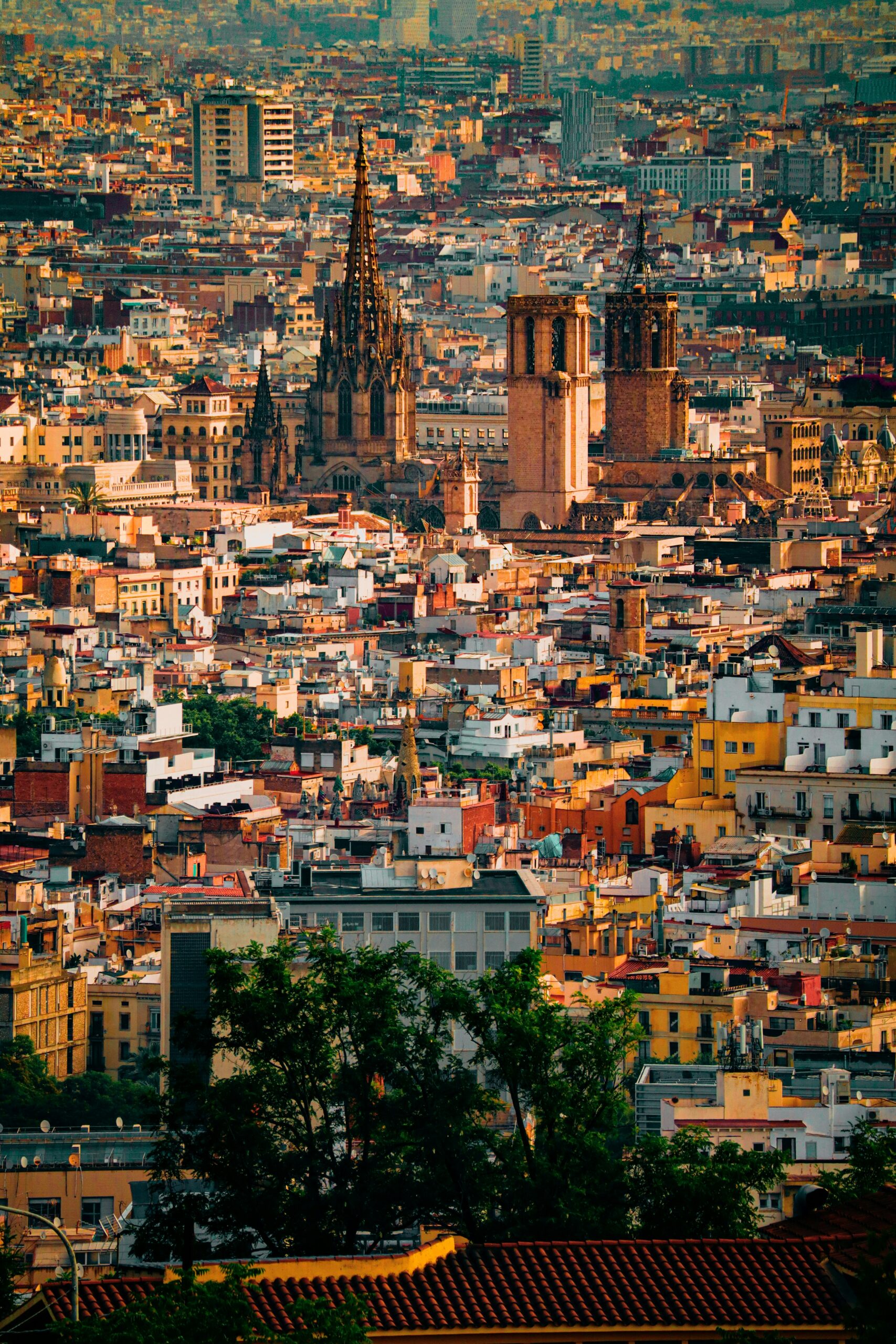 Barcelona city skyline featuring historic cathedral towers and dense urban architecture.
